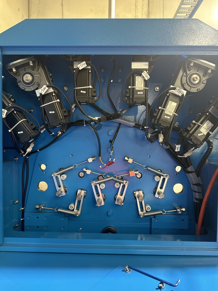 Close-up of a circular textile machine mechanism
