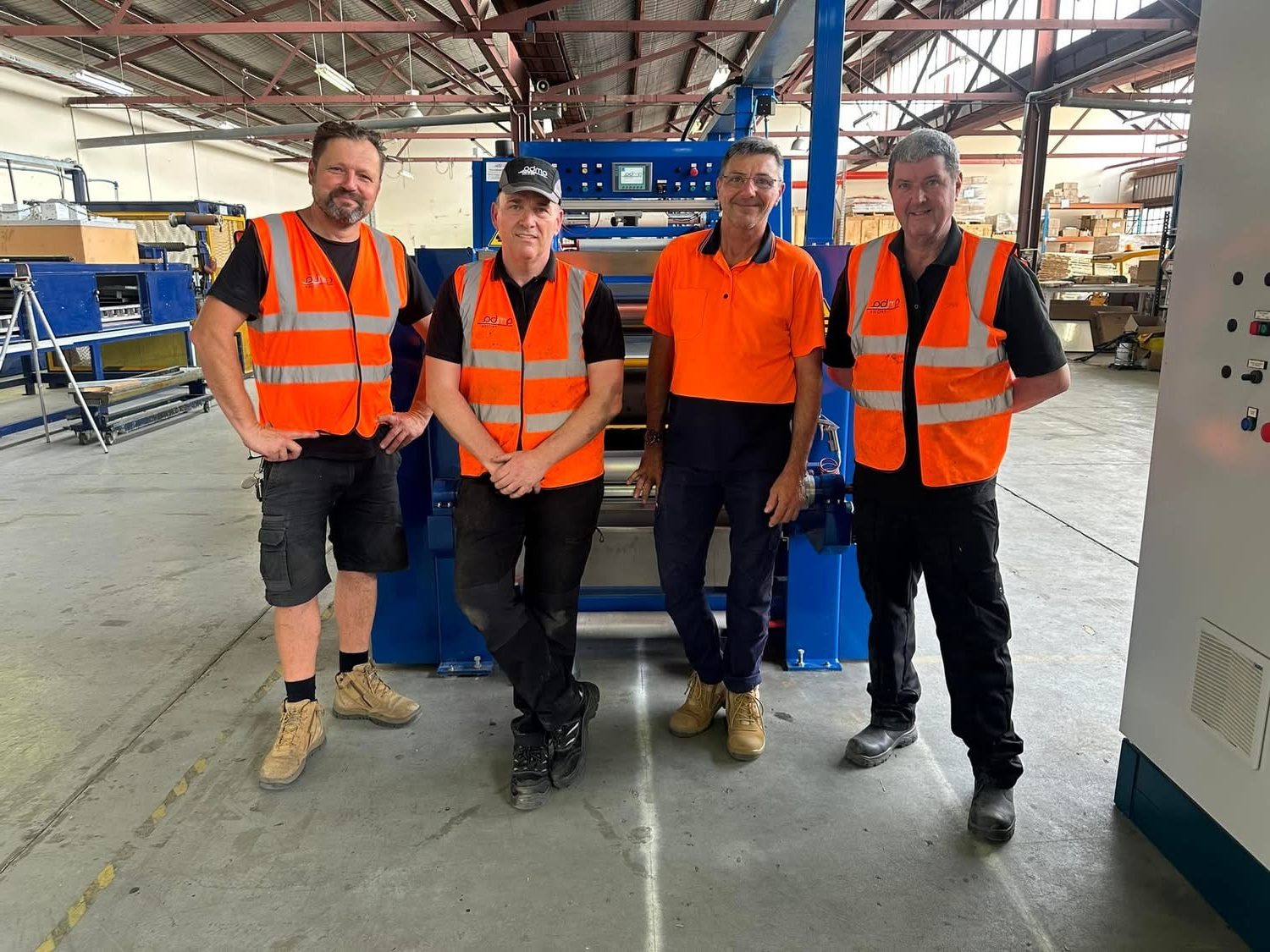 The George Black Textile Group team on the factory floor with coating and lamination machinery